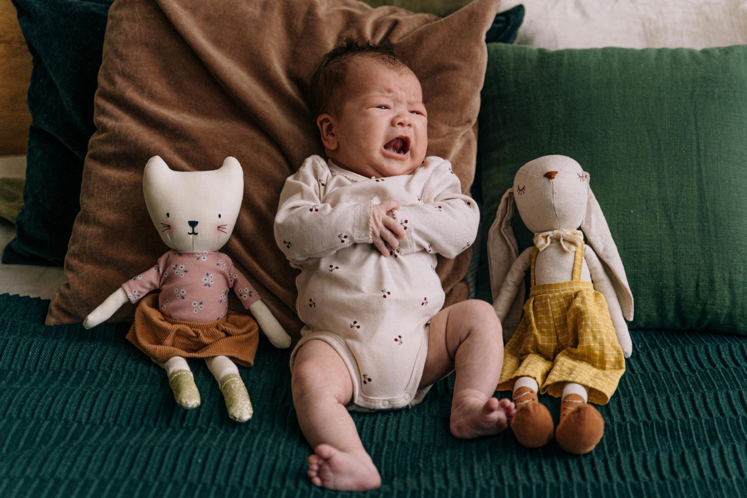 baby crying on couch